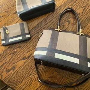 satchel handbag with 2 zip up pouches.